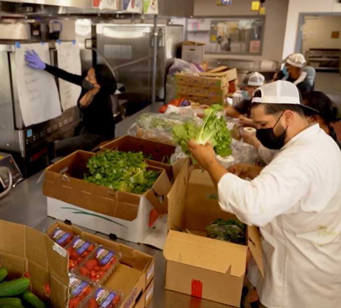 The Neighborhood Business Initiative Chefs organising ingredients in a kitchen