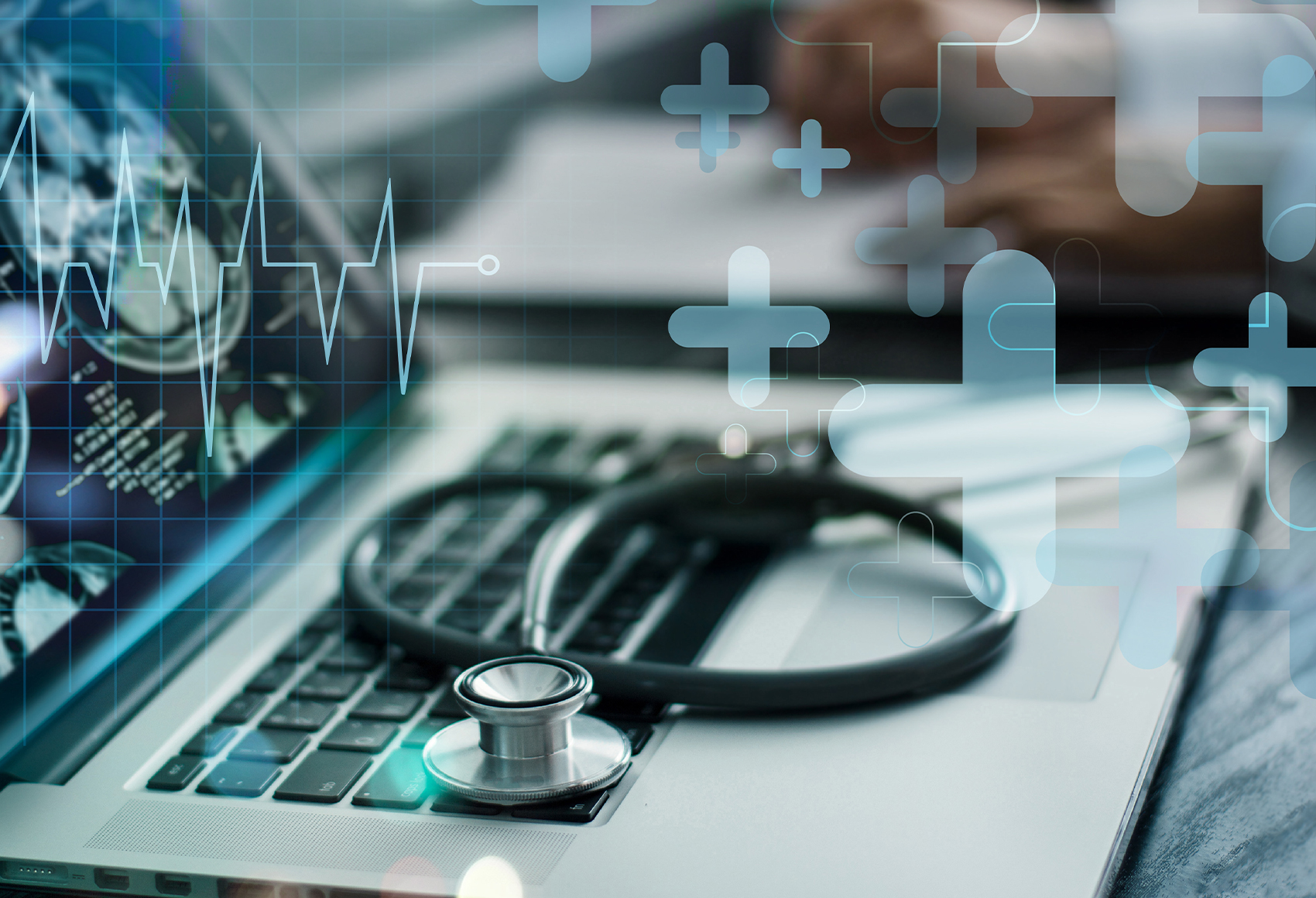 Image of a stethoscope resting on a computer