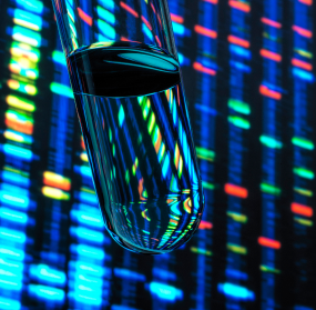 Glass test tube in front of brightly colored DNA sequencing bands.