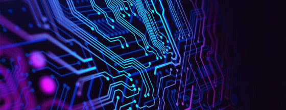 Glowing blue and purple circuit pathways branching across a dark background.