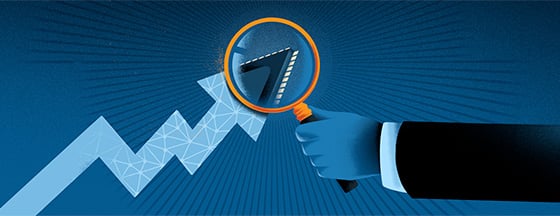 Magnifying glass over an upwards arrow