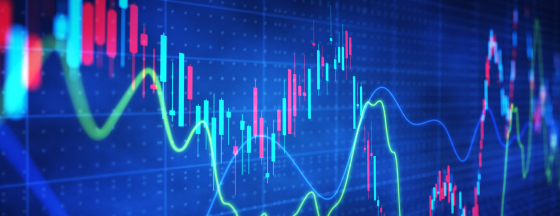 Colorful financial candlestick chart and trend lines on a blue digital screen