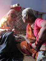 Skilled artisans in rural India work on a challenging scarf by a Finnish designer. The scarves were made for an Indian customer who gave them as gifts at an event in Boston.