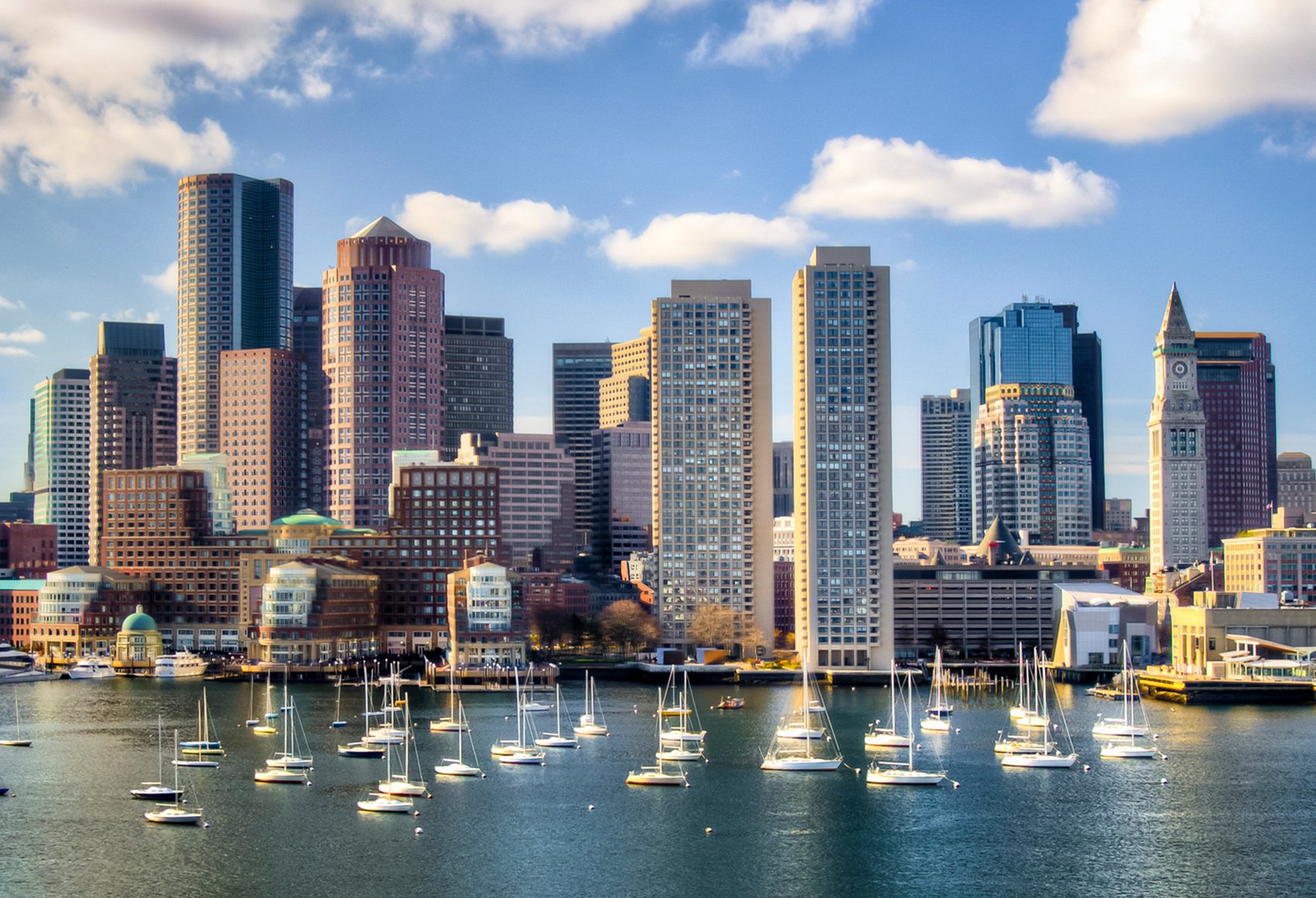 Daytime shot of the Boston downtown skyline and view of the Boston harbor