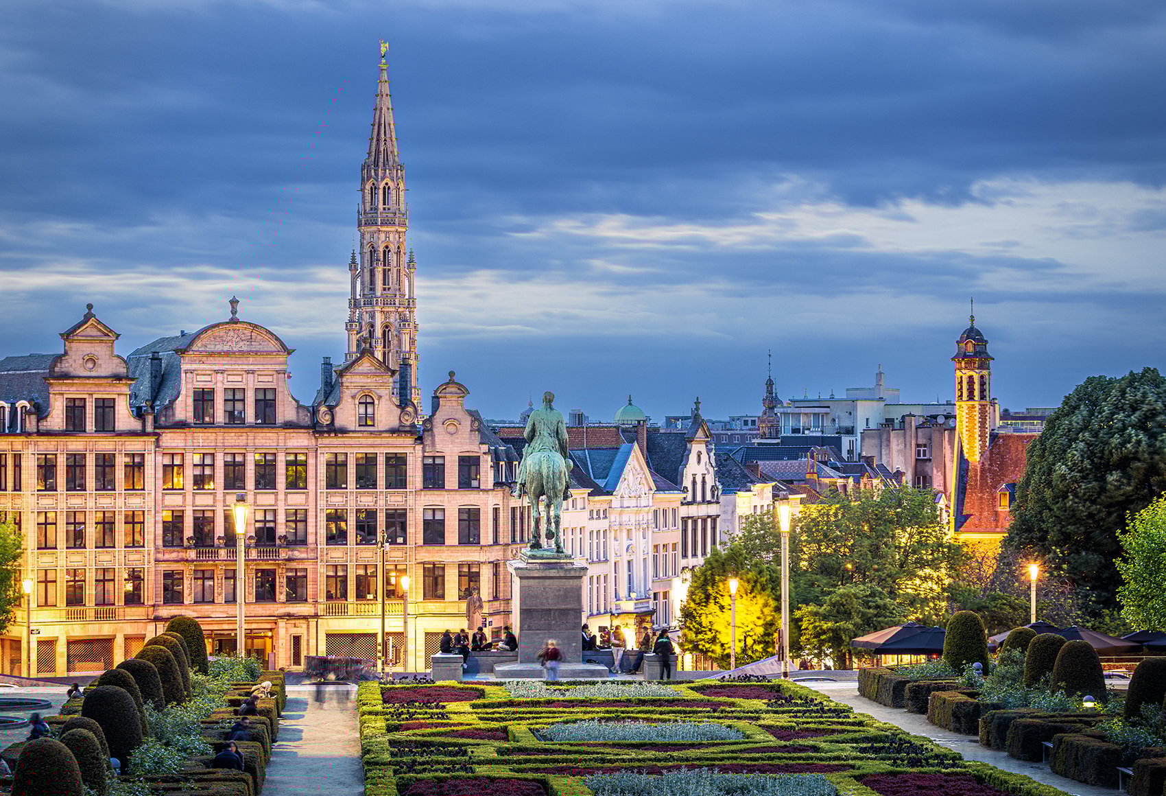 Mont des Arts in Brussels, Belgium, with a geometric garden and historic buildings in the background.