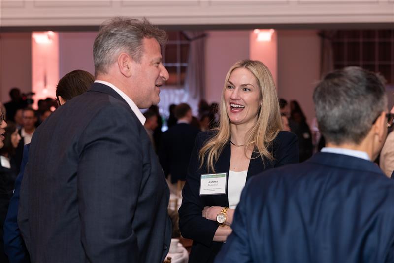 Audience engaging with speakers at the Goodwin real estate capital markets conference.