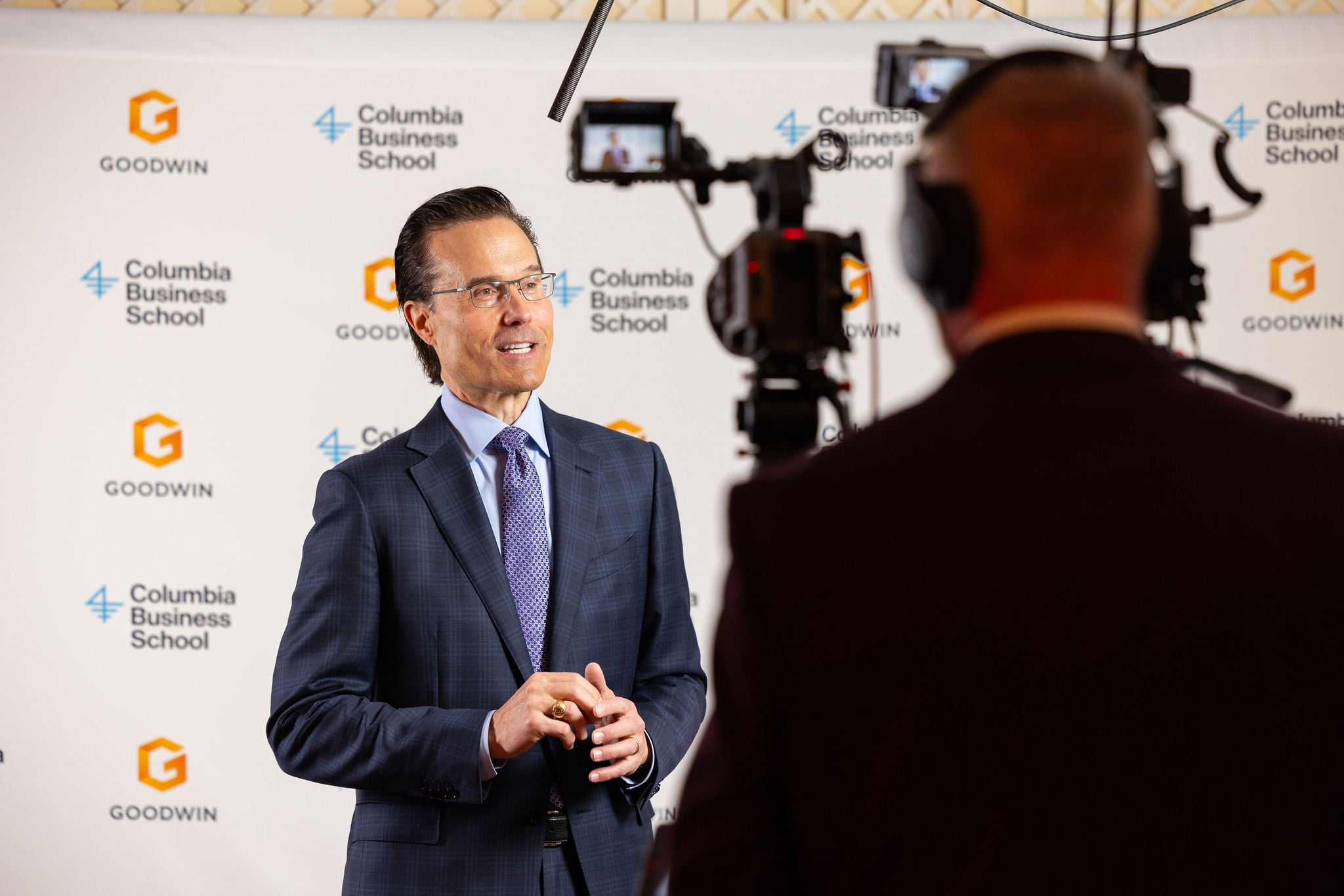 Executive being interviewed on camera at the Columbia Business School Real Estate Capital Markets Conference.