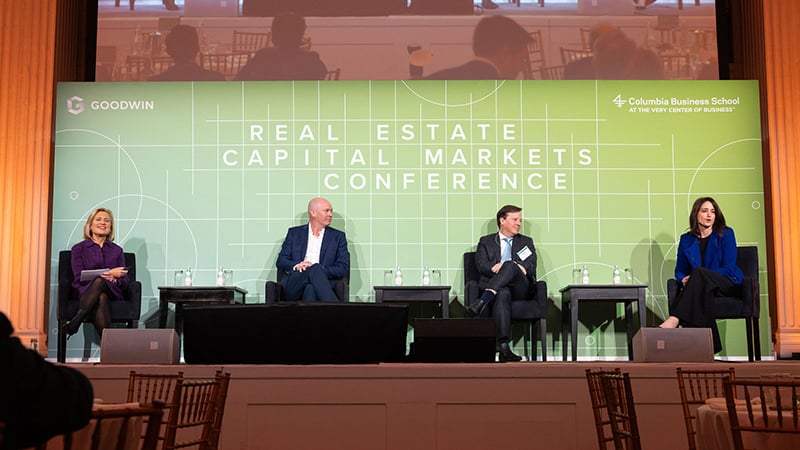 Real-estate leaders engage in conversation on a panel about global flows of capital at RECM on March 27