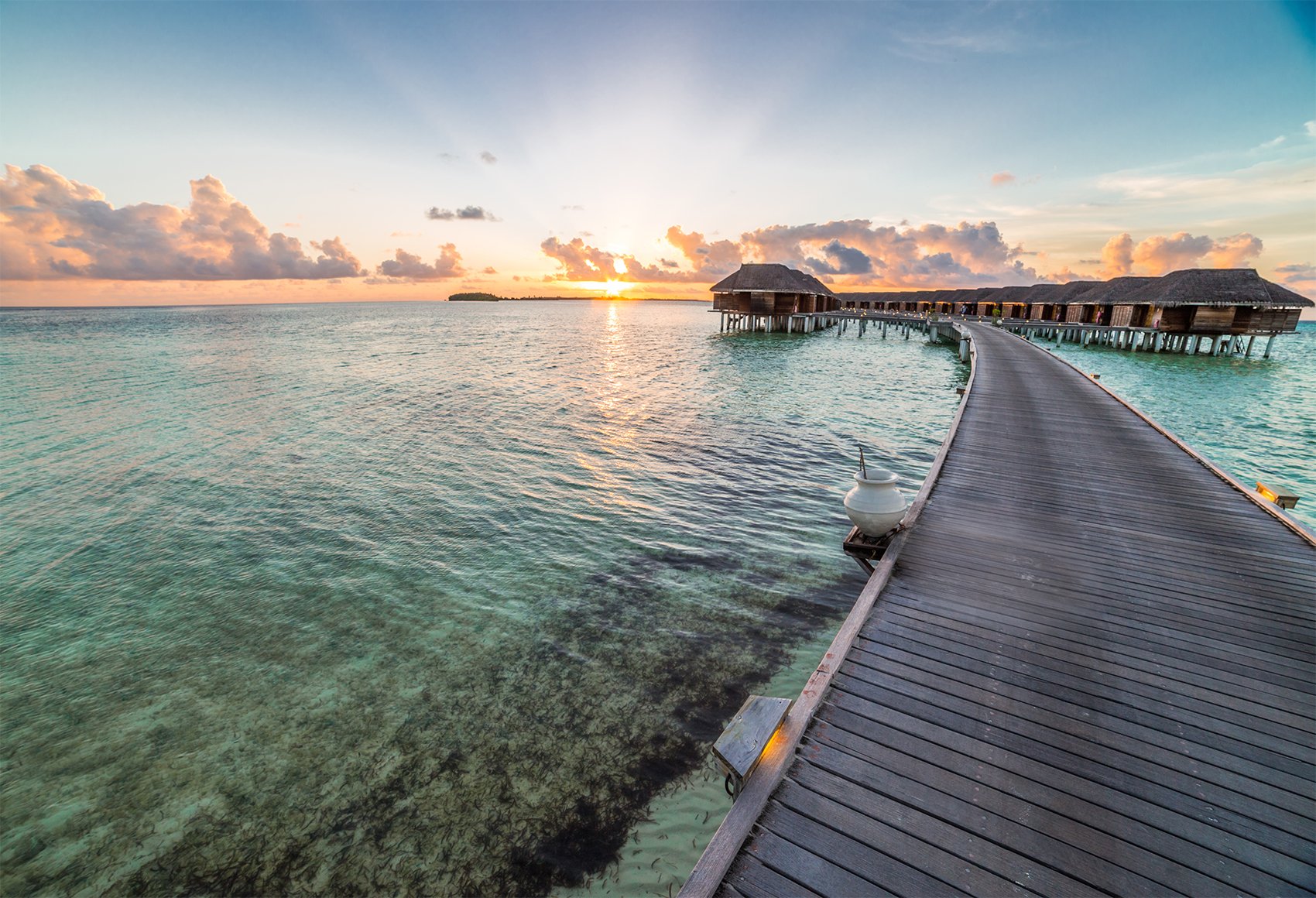 Oceanfront wooden road with sunset