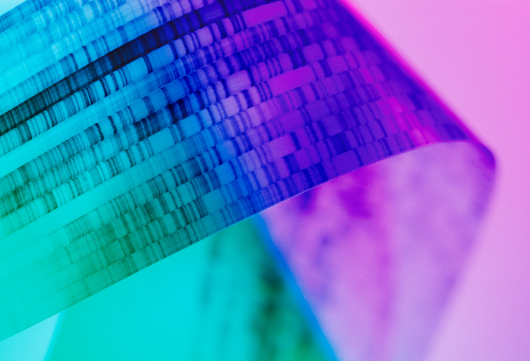 A medical instrument behind a blue to purple gradient