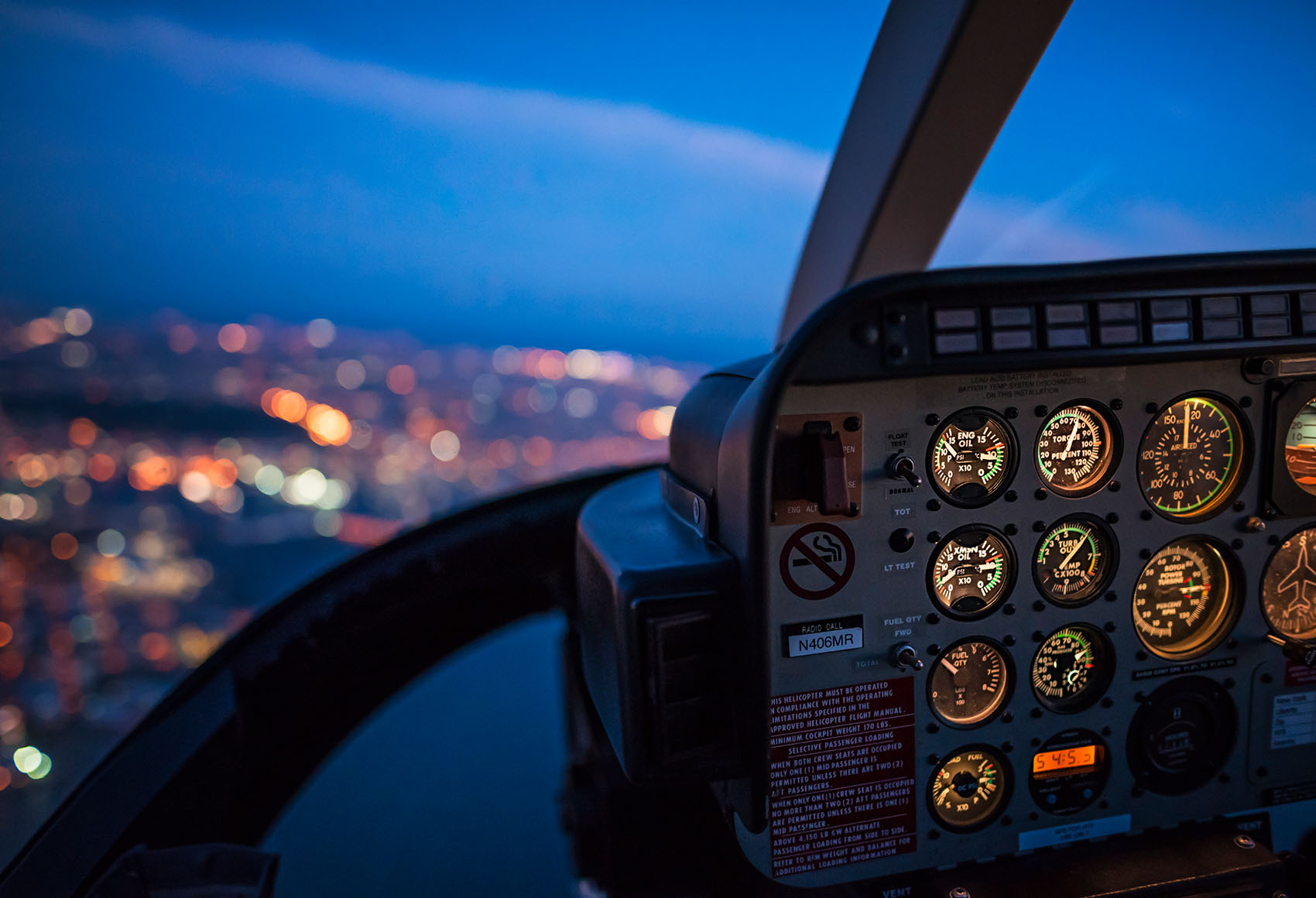 Inside of a plane showing the view from a pilot's window.