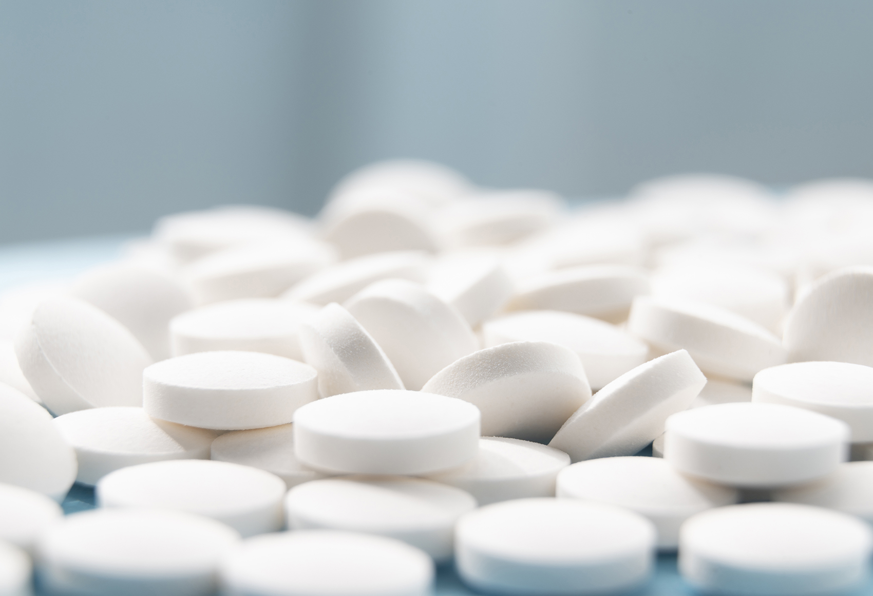 A medical instrument behind a blue to purple gradient