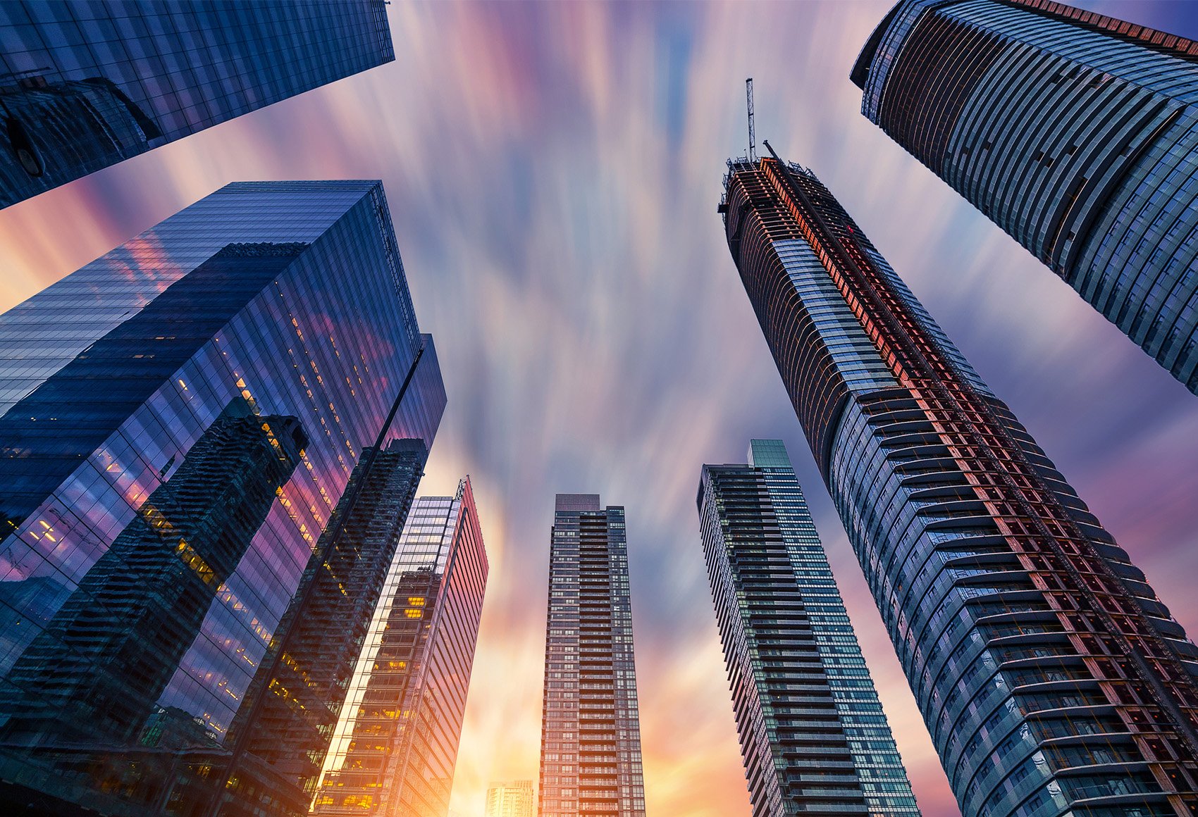 Skyscrapers against a sunset