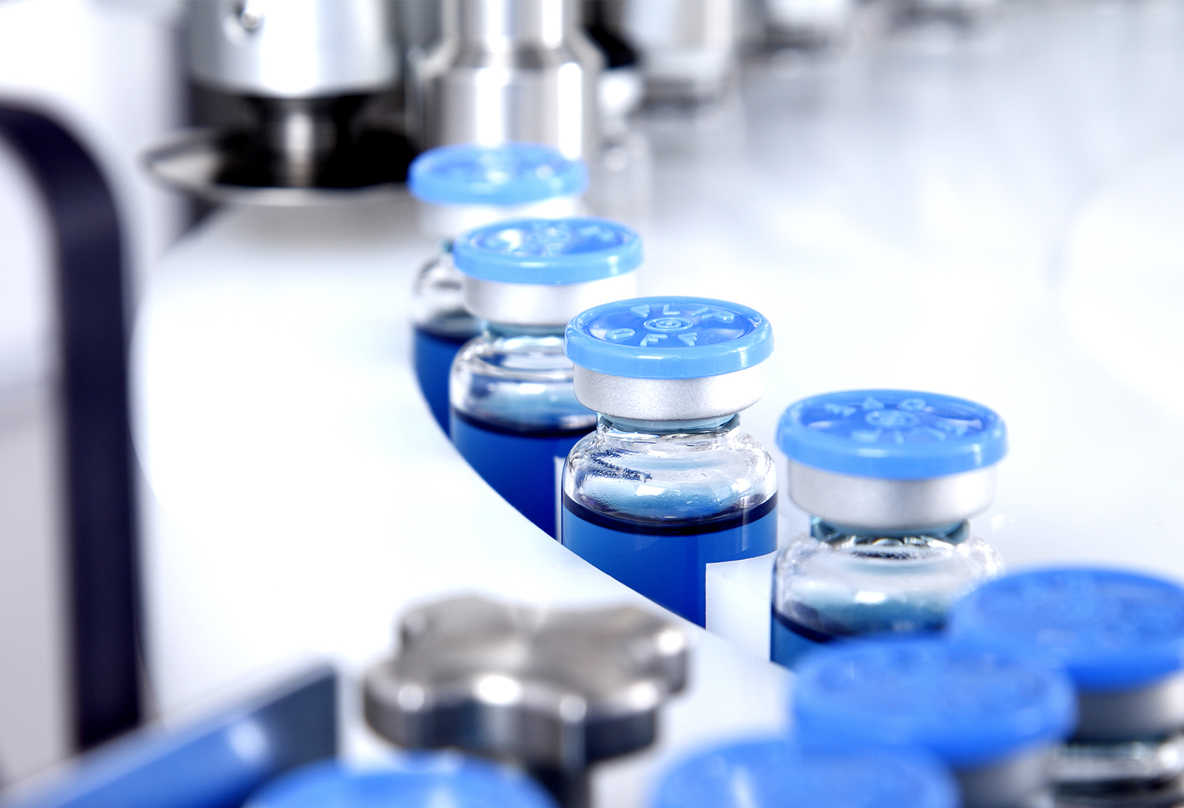Vials in a factory setting Sealed medicine vessels within a production cycle